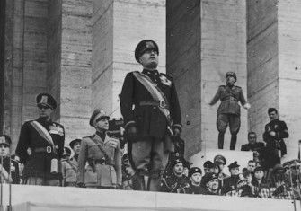 Benito Mussolini at a ceremony for the Italian Academy of Physical Education in Rome, 1940. Narodowe Archiwum Cyfrowe. Public Domain.