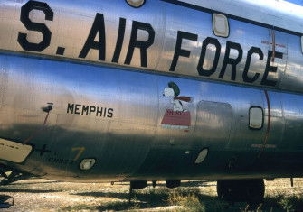 Snoopy’s Flying Ace adorns the fuselage of a U. S. Air Force Boeing C-97 Stratofreighter, c. 1970s. SDASM Archives. Public Domain.