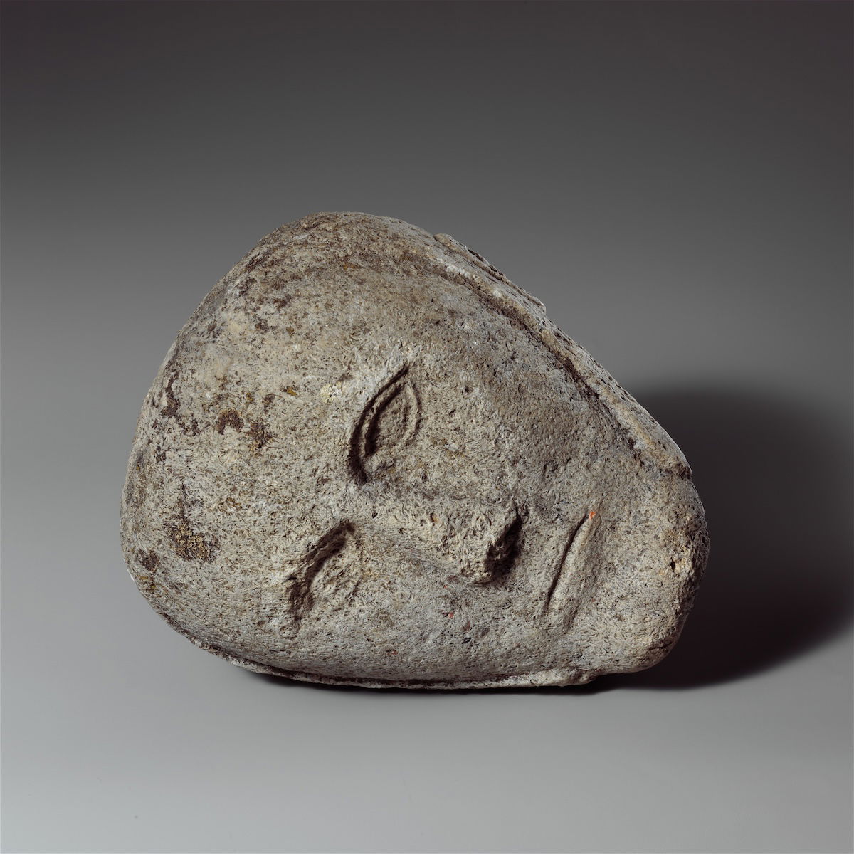 Stone head of a man wearing a cap or helmet, found in Yorkshire, c. 2nd-3rd century. Metropolitan Museum of Art. Public Domain.
